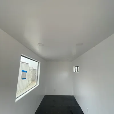 Houten frame, R13-isolatie, afwerking met gipsplaat (40' High Cube)